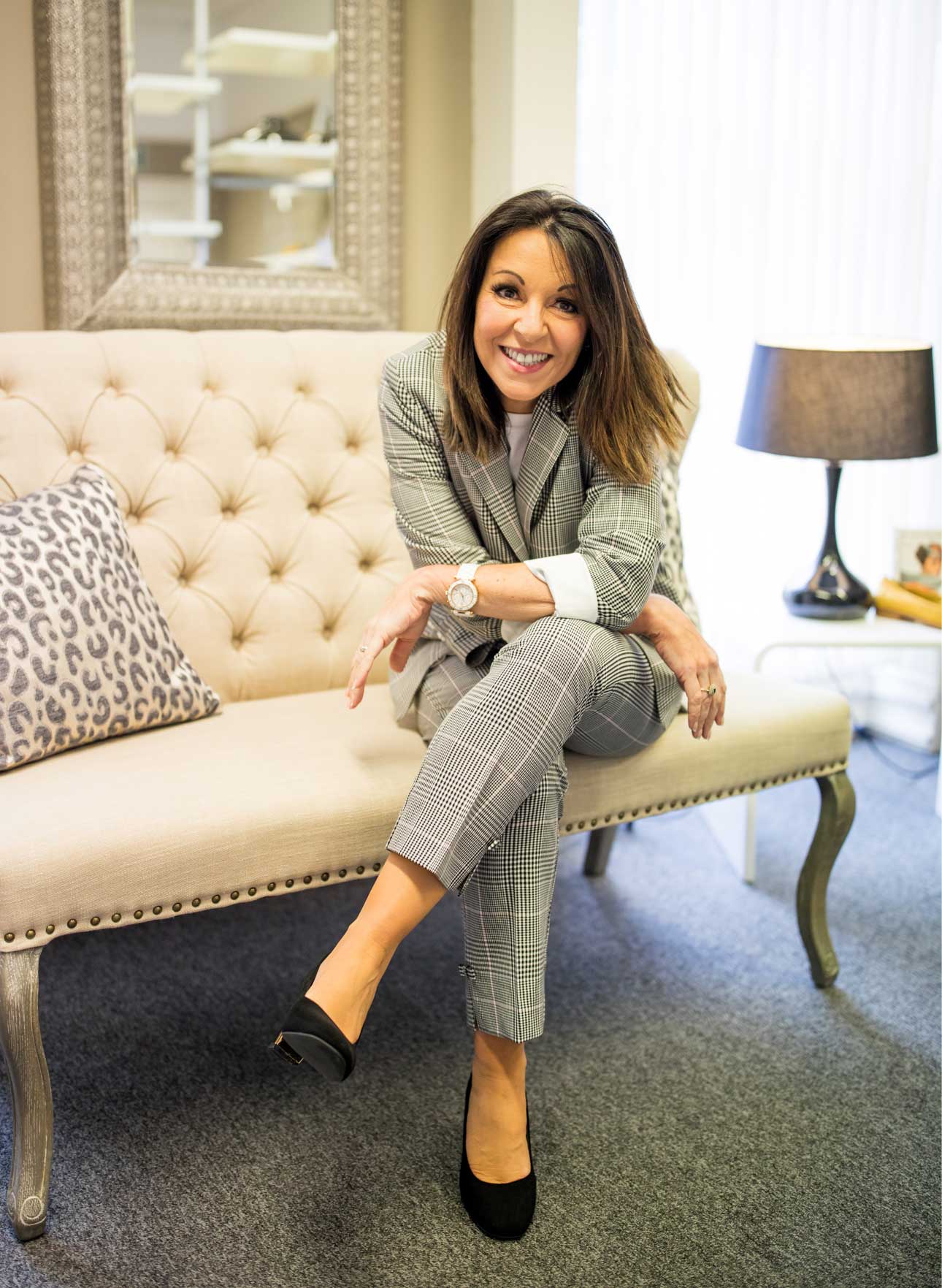 Tracey Redmond in the Style Coaching Institute sitting - wearing a check suit